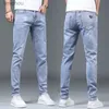 Jeans masculinos nova primavera e outono azul lavado moda coreana casual sólido magro cowboy estiramento denim adolescentes calças de luxo apertado jeans l240119
