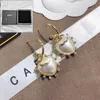 Boucles d'oreilles pendantes de créateur avec logo classique - Design de bijoux pour femme - Plaqué or - Style tendance - Bijoux pour femme - Style boutique - Cadeau d'amour
