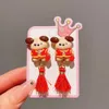 Barns röda klipp kinesiska stilörhängen lyckligt tecknad tasslar flickors örhängen utan öronhål nyårsmycken