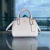 2023 Nuevo Half Moon Glacier White Coating Old Flower Un hombro Crossbody Mantou Bag Girl 80% de descuento en salidas slae