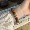 Strand UMQ Handcrafted Bracelet With Yabai Wood Abacus Beads And Tibetan Silver