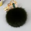 Nyckelringar stora 10 cm fluffiga riktiga päls boll pom poms naturliga pompom läder rem nyckelring nyckelkedja ring hänge för kvinnor charm