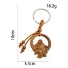 Porte-clés Charms Amulette Bouddha sans entrave de la liberté Maitreya Pendentif en bois de pêche Porte-clés Anneaux Zen Méditation Mascotte Dangle Bourse Bijoux