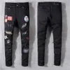 Jeans da donna firmati Jeans da motociclista strappati effetto consumato Denim dritto sottile per pantaloni skinny da uomo alla moda militare con stampa da uomo