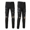 Jean skinny noir pour homme avec patchs brodés de serpent en cuir au genou