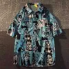 Kvinnors blusar skjortor Japan Comics pojke graffiti anime män skjortor roliga strand hawaii knapp upp skjorta lösa stora 2xl sommar tee topps harajuku fritid yq240120