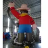 Anpassade västerländska rekvisita uppblåsbar tecknad cowboy -karaktär frakt Uppblåsbar cowboy -modell med fläkt för reklam