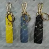 Keychains colhedas de designer de mensagens -chave de couro chaveiro de luxo para mulheres keychains de carrocas de aço inoxidável