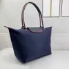 2024 The New Womens Hobo Dumpling Tote Bags Mens Luxurysハンドバッグナイロンキャンバ肩の買い物客ビーチデザイナーバッグファッションクラッチアンダーアームウィークエンド旅行クロスボディB