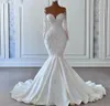 Splendido abito da sposa a sirena 2024 Donna Sheer Neck Perline Pizzo Maniche lunghe Bottoni Indietro Pizzo Appliuqes Abiti da sposa Vestido De Novia