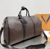 Designer quente dufflemen mulheres moda bolsa de viagem grande capacidade bolsa clássico impresso revestido lona couro bolsa de viagem bolsa de embarque