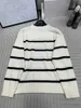 Kvinnors tröjor Designer Classic Black and White Stripe Contrast 2024SS Tidig vår Nytt ullmaterial Simple Sticked Round Neck Pullover JZPL