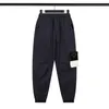 Pantaloni da uomo Cargo Streetwear Pantaloni casual stampati Hip Hop Pantaloni militari retrò multi-tasche Salopette dritta allentata Bottone Coppia pantaloni da allenamento gamba dritta taglia S-XL