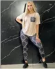 Summer Nfew Women's Brand New Tracksuits Designer 2 Piece Set Letter Print G Kort ärm T-shirt+Pant Sexig Back Lace Beigt Tshirt Legging Pants