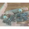 24SS Designer Miui Miui Earring Miao's New Pearl Bow Earrings Women's Flash Diamond Exaggerated Fashion Temperament Pearl Bow Earrings