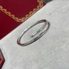 Bracciale rigido per unghie in acciaio al titanio di design di lusso Braccialetti con polsini a vite con diamanti Donna Uomo Gioielli di marca per il regalo della festa nuziale Alta qualità