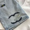 Kvinnors designer kjolar sommar modebrev broderi grafisk wrap kjol hög midja antislip denim kort kjol