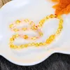 Sieraden Haohupo Originele Baltische Amber Tandjesketting voor Vrouwen Leveringscertificaat Roze Kristal + Gouden Amber Armband voor Babycadeau