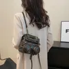 Torby szkolne luksus projektant 2024 Retro mini skórki plecak dla kobiet ramię dla dziewcząt plecaków turystyczny