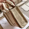 Väska mini linne tote woody canvas designer crossbody väskor kvinnor s designers små totes shoppare handväska kors body band brown216d s s mall s hopper