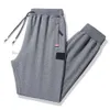 Calças 2023 moda espartilho calças masculinas novo outono perna reta casual solto casal correndo pedra sweatpants feminino