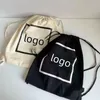 Designer-Damenmode, schwarz-weiße Canvas-Tasche, klassischer Logo-bedruckter Rucksack, große Kapazität, Einkaufstasche, einzelne Umhängetasche, tragbare Strandtasche, umweltfreundlich