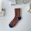 Calzini da donna 1 paio elegante Corea Harajuku donna floreale vintage nero giallo jacquard cotone etnico casual ragazze carine vestito Sox autunno