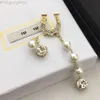 Ontwerper Miui Miui Earring Miao Family's nieuwe U-letter pareloorbellen Hoefijzergespen Premium Ab-oorbellen met diamanten Lange asymmetrische oorbellen