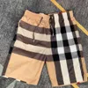 pantaloncini estivi da uomo pantaloncini firmati moda uomo donna classico modello a righe con lettera pantaloni da spiaggia casual costume da bagno sportivo con coulisse allentato