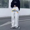 Mäns jeans flamma broderad bootcut skarvad och kvinnors amerikanska mode retro tvättade high street trend ins raka byxor