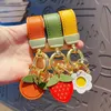 Nyckelringar utsökta alla önskningar går i verklighet orange exklusiv bilnyckel hängande prydnadsläder nyckelring kvinnlig mode jordgubbe fruktkedja