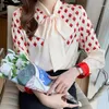 Kvinnors blusar mode tryckt snörning båge kvinnliga kläder 2024 Autumn överdimensionerad lös pendeltröja elegant