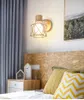 Lampada da parete Corridoio creativo nordico Camera da letto semplice Comodino Stile giapponese in legno massello Arte del ferro Soggiorno
