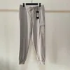 Calças masculinas 23ss roupas de grife a melhor qualidade calças cp calças masculinas calças femininas calças esportivas casuais inverno outwear hip hop calças ladys pant com emblema ásia siz