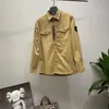 Jaquetas masculinas 23ss primavera pedra bússola emblema manga remendada mulheres homens bolso casaco streetwear turn down colares windbreaker lavagem camisa 771 03