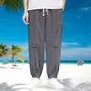 Pantalones de hombre de moda de algodón y lino casual de gran tamaño con botones de pierna ancha