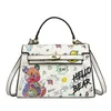 grossist mode handväska söt liten färsk graffiti mode axel väska trend tecknad damer handväska i år populära tryckt läder ryggsäck 7015#