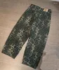 Pantalones para hombres Hombres Estilos callejeros con estampado de leopardo Pantalones de baile holgados Monopatín Pantalones cruzados