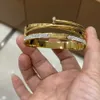 Het försäljning fin smycken lyx mode guld pläterade armband rostfritt stål kvinnor män armband armband
