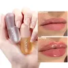 Brillo de labios día noche volumen instantáneo labios carnosos aceite hidratante reparación Reduce labio línea fina suero cosmético brillo de labios Sexy maquillaje