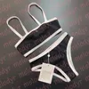 Costume da bagno di lusso lavorato a maglia in metallo con lettera bikini in un pezzo per le donne Costume da bagno sexy in due pezzi biquinis diviso per le vacanze termali