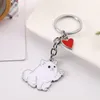 Porte-clés 100pcs / lot teckel chien animal de compagnie agitant porte-clés sac en métal de haute qualité voiture charme pendentif porte-clés bijoux cadeaux accessoires d'amour