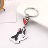 Porte-clés 100pcs / lot teckel chien animal de compagnie agitant porte-clés sac en métal de haute qualité voiture charme pendentif porte-clés bijoux cadeaux accessoires d'amour