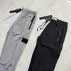 Pantaloni da uomo Pantaloni cargo da uomo Designer di marca Stone Stagione Due colori Isola Primavera Nylon Riflettente Sottile Pantaloni da jogging leggeri Streetwear Pantaloniumky