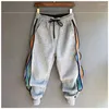 Pantaloni da uomo Hip Hop Streetwear Uomo Patchwork a righe Harem Pantaloni sportivi da jogging con risvolto ampio per uomo