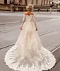 2024 Una línea de vestidos de novia cortos Vintage fuera del hombro Mangas largas Apliques de encaje Faldas de tren desmontables Dos piezas Hi Lo Longitud Tren de barrido Vestidos de novia atractivos