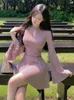 カジュアルドレスセクシーなピンクのニットドレス女性Oネックホローフレアスリーブa-lineプリーツ秋のセーター韓国ファッションスリムベスティドス