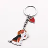 Porte-clés 100pcs / lot teckel chien animal de compagnie agitant porte-clés sac en métal de haute qualité voiture charme pendentif porte-clés bijoux cadeaux accessoires d'amour