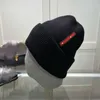 Beanie/Skull Caps Designer Ny stickad hatt unisex bokstav vinter varm ullhatt västra krullad stickad hatt