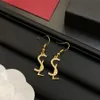 Boucles d'oreilles lettre élégantes pour femmes, boucles d'oreilles de styliste simples et brillantes, charme classique élégant, 2 couleurs